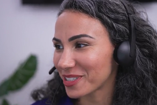 A female ADT Customer Care employee wearing a microphone headset.